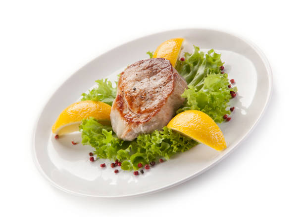 istock Fish dish - fried tuna steak and vegetables 701021916