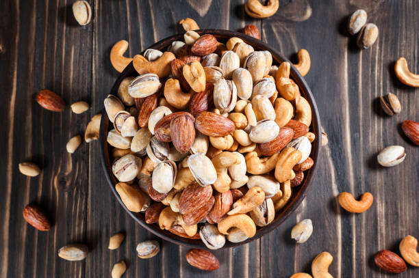istock Mixed Nuts on dark background. Healthy food and snack. 701022096