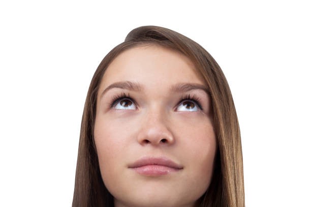 istock Young girl s face looking up isolated 701024786