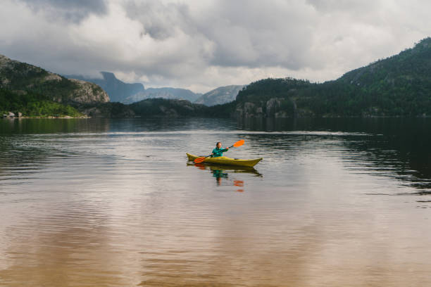istock Woman kayaking on the lake in Norway 701030090