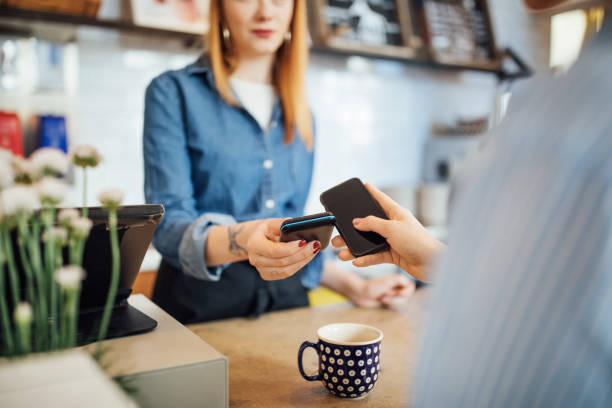 istock Barista receiving contactless payment at cafeteria 701038856