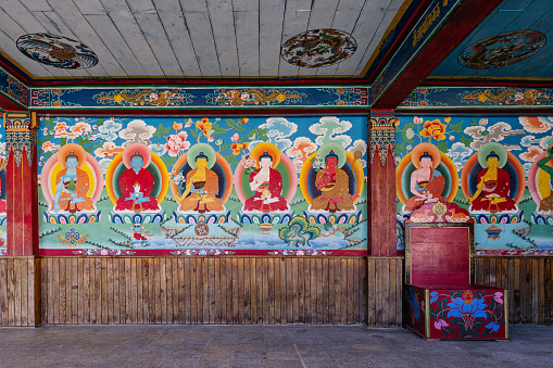 Painted Buddha images in the temple of Tibetan Buddhism Temple in Sikkim, India.