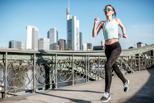 istock Woman exercising in Frankfurt city 701039072