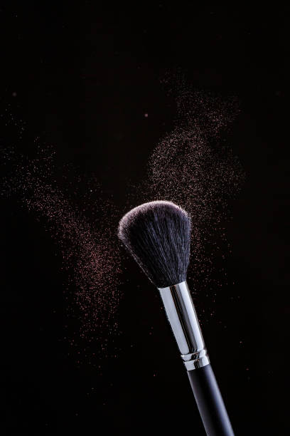 istock Brush and cloud powder on a black 701044446