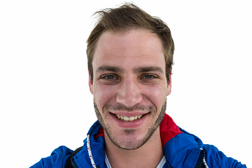 Close up view of a backpacker smiling on white background