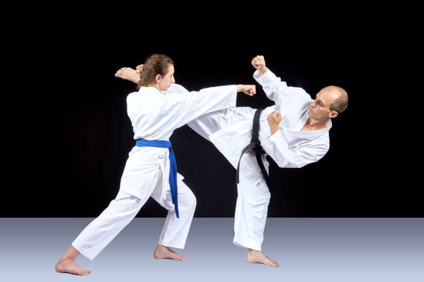 istock Kick leg and striking with a hand are trained by athletes 701055446