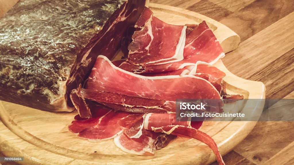 Smoked ham. Smoked ham sliced on cutting board. Appetizer Stock Photo