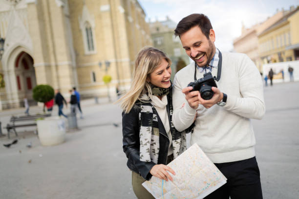 istock Tourist couple enjoying sightseeing and exploring city 701055600