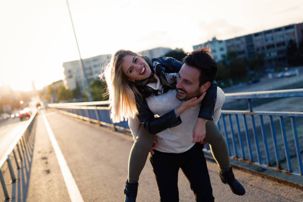 istock Happy young attractive couple spending time together 701058236