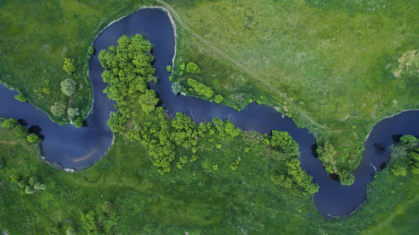 istock A beautiful narrow and winding river view from above. 701085468