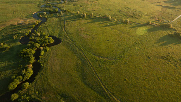 istock A beautiful narrow and winding river view from above. 701088028