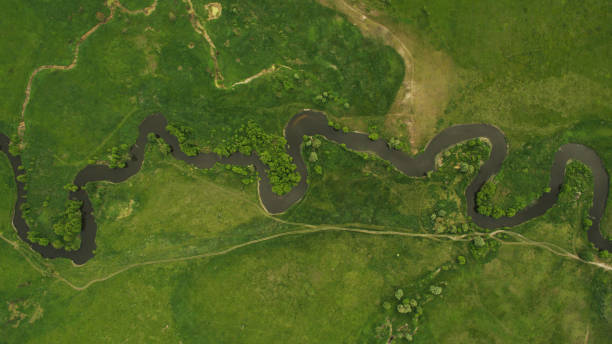 istock A beautiful narrow and winding river view from above. 701088388