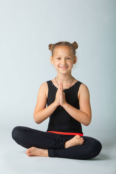 istock beautiful woman doing yoguna white background 701090672