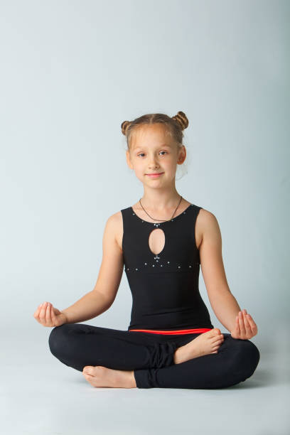 istock beautiful woman doing yoguna white background 701090712