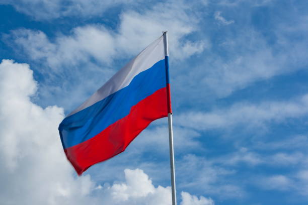 istock Flag of Russia against the blue sky 701095564