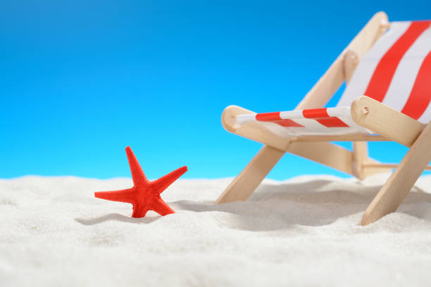istock Red starfish near a lounger on the beach 701100524