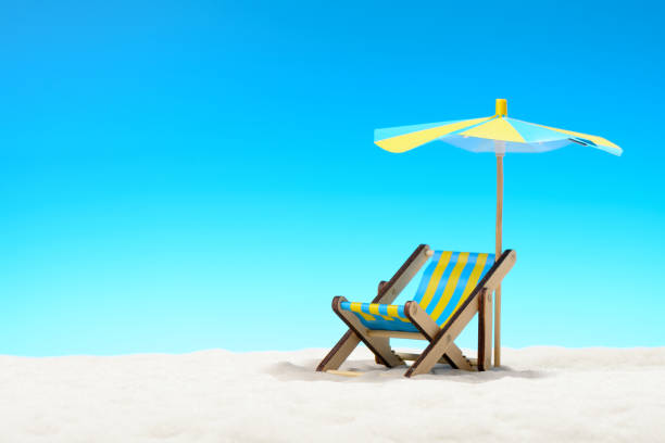 istock Sunbed at the beach on background of blue sky 701100634
