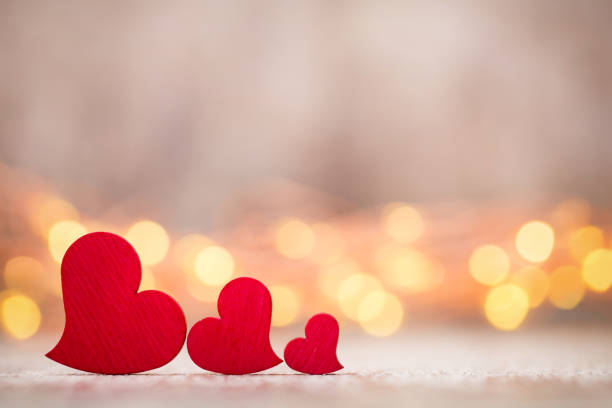 istock Red hearts on the wooden background. 701100868