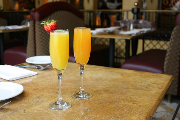 istock Two mimosa cocktail glasses lifestyle 701120286