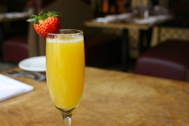 istock Single mimosa cocktail glass, horizontal 701120300