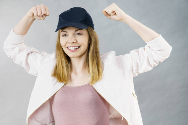 istock Young woman showing her arm muscles 701149690