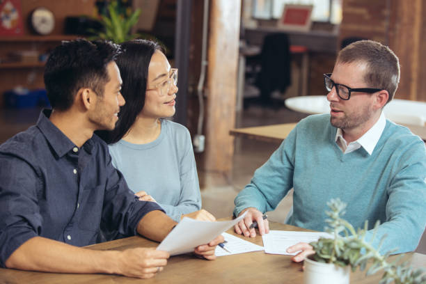 istock Couple getting financial advice 701150092