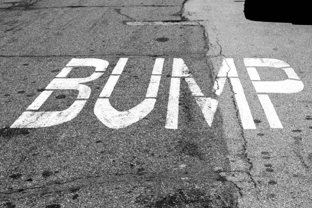BUMP sign painted on the road