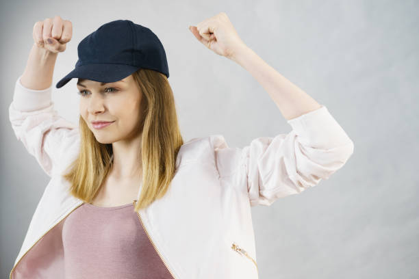 istock Young woman showing her arm muscles 701152794