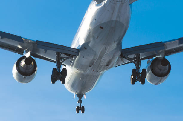 istock Passenger airplane landing on runway in airport day. 701174986