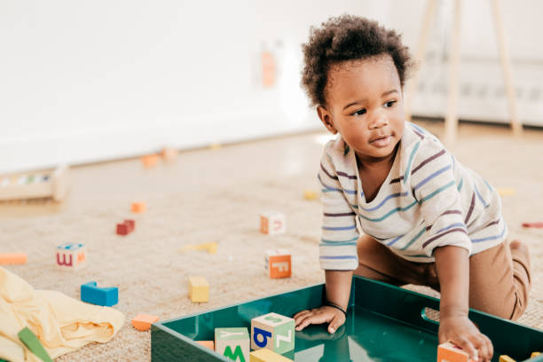 istock Toddler with toys 701181094