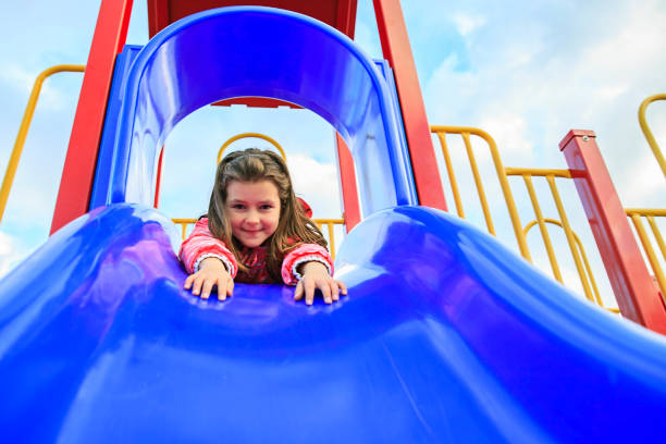 istock Girl at Playground Slide 701184312