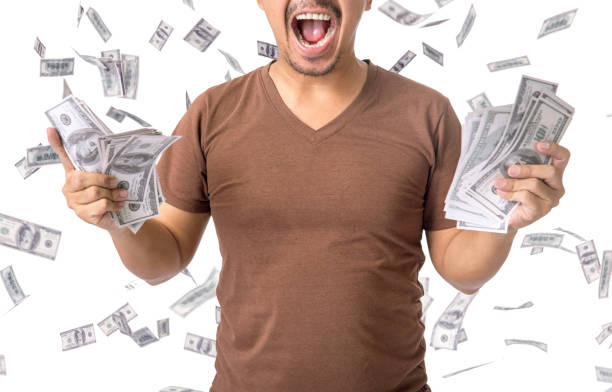 istock standard asian man get jackpot dollar. 701189054