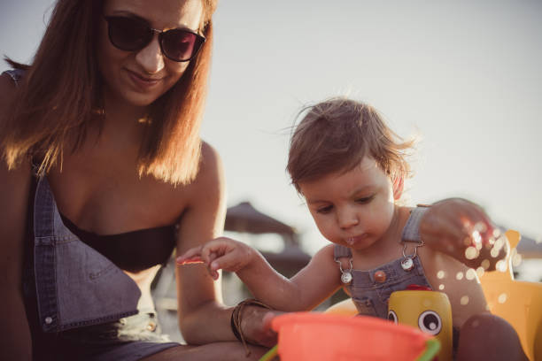 istock Mother playing with daughter 701189150