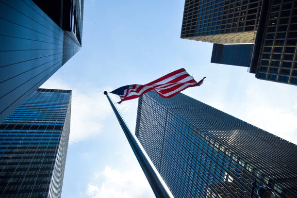 istock American Flag & Corporate Buildings 701191488