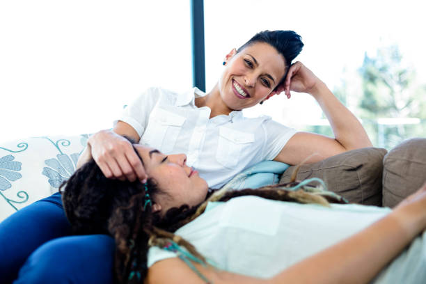 istock Woman relaxing on her partners lap 701193632