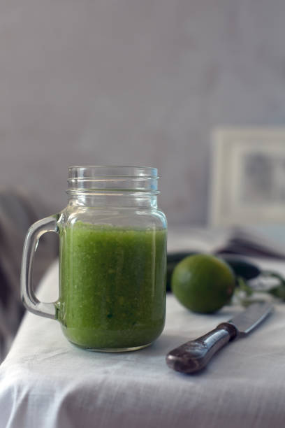 istock Fresh organic green smoothie with spinach, cucumber on a white tableware 701195862