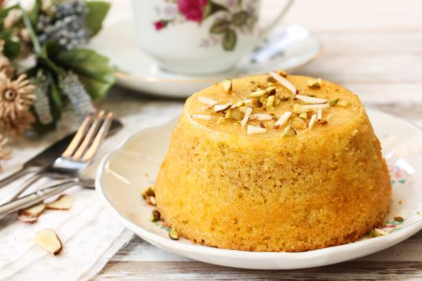 istock Gluten free Almond cornmeal cake topped with nuts, selective focus 701196042