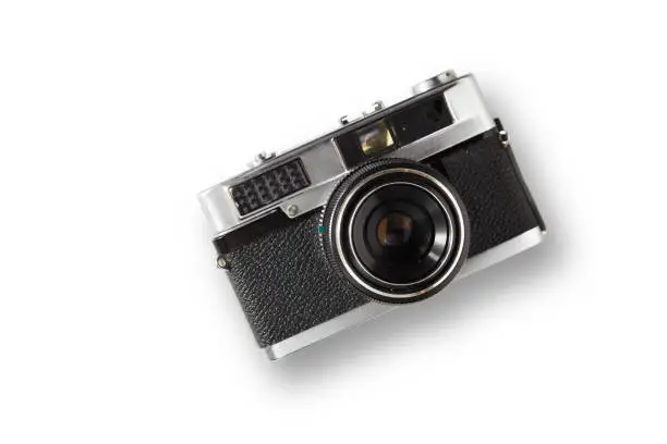 Old rangefinder vintage camera on white background