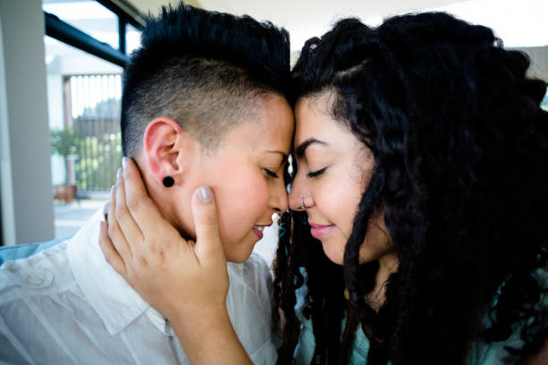 istock Lesbian couple embracing each other and smiling 701201264