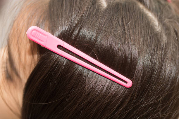 istock barrette in her hair 701206476