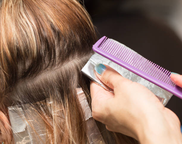 istock weave hair in a beauty salon 701208634