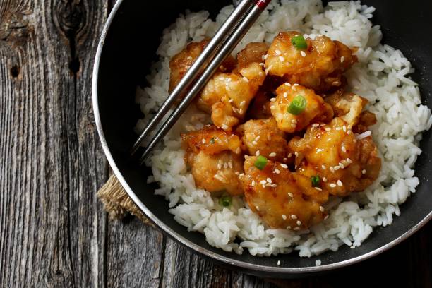 istock Honey Sesame Chicken served with Jasmin rice 701208802