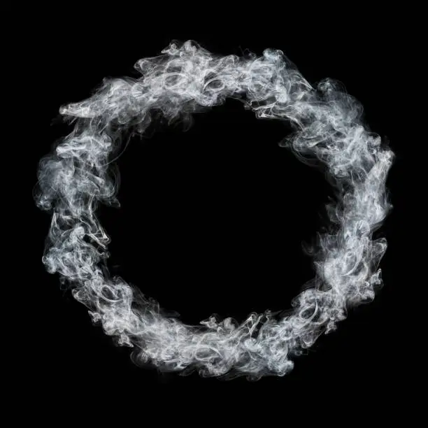 Photo of circle white smoke frame isolated on black