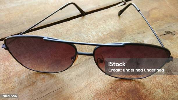 Closeup Goggles Background And Fashion Sunglasses On Wooden Table Stock Photo - Download Image Now