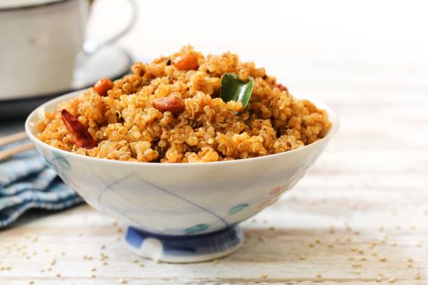 istock Quinoa Puliyogare or Puliyodharai served in a bowl, selective focus 701216920