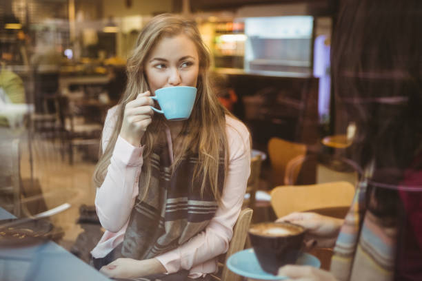 istock Woman drinking a cup of coffee 701219524