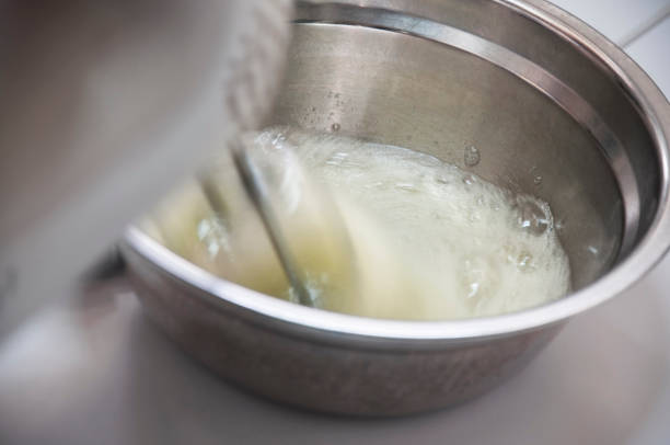 istock Using electric whisk stirring the egg white. Egg white used for preparing cake. 701227878