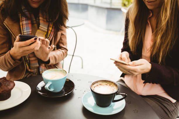 istock Friends looking at smartphone 701230940
