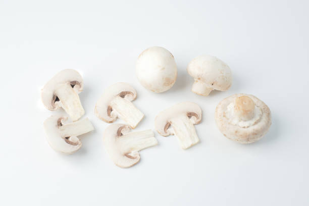istock Isolated sliced white mushrooms, white background 701249194