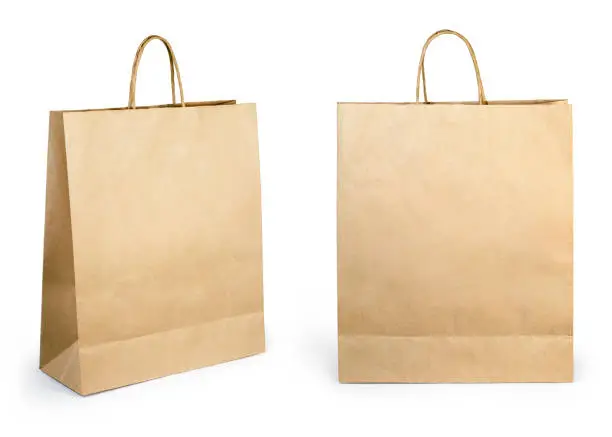 Photo of Blank brown paper bag isolated on white background